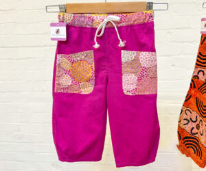 Kids Pink pants with flower pockets by The Laughing Kookaburra