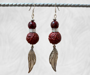 Painted Quandong and leaf earrings by Dja Yingila