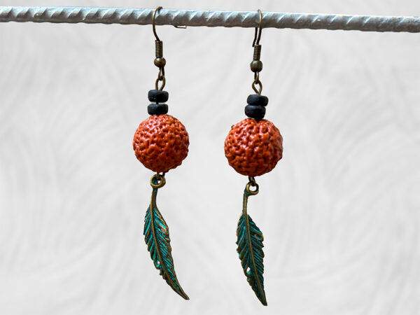 Painted Quandong and feather earrings by Dja Yingila