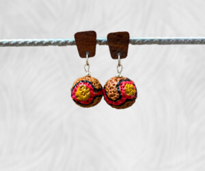 Painted indigenous quandong earrings by Dja Yingila